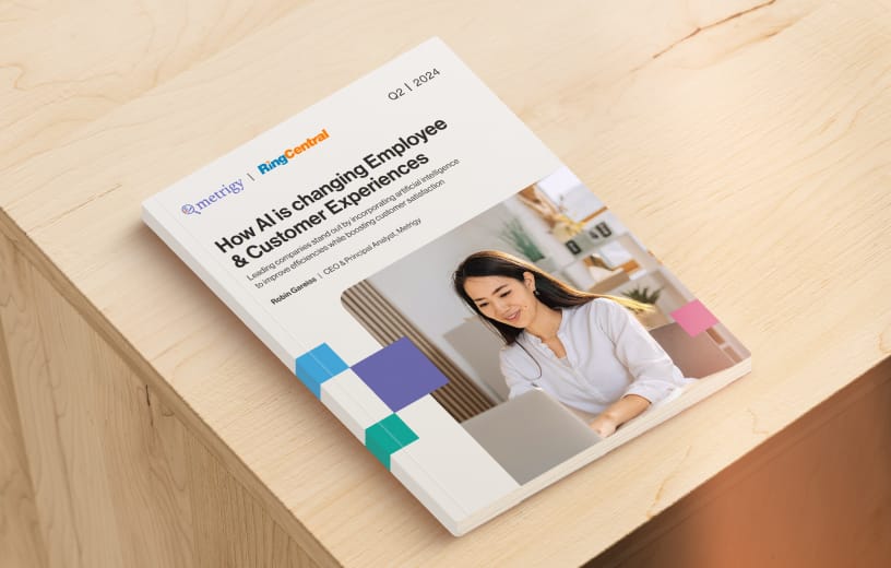 A Metrigy report eBook cover showing a woman woking on a laptop