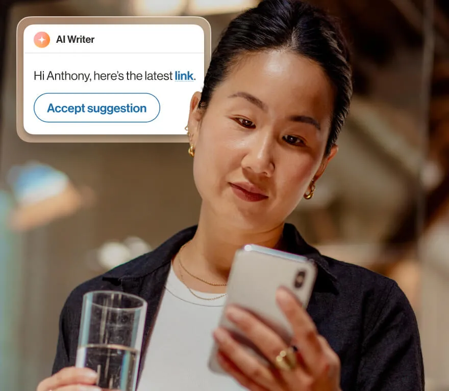 A woman using RingSense AI writer feature to send a message on her phone