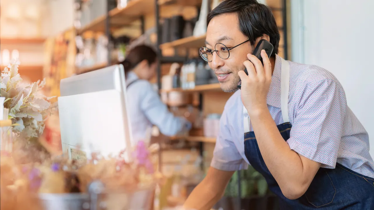 A baker receiving a phone call routed from the RingCentral auto attendant