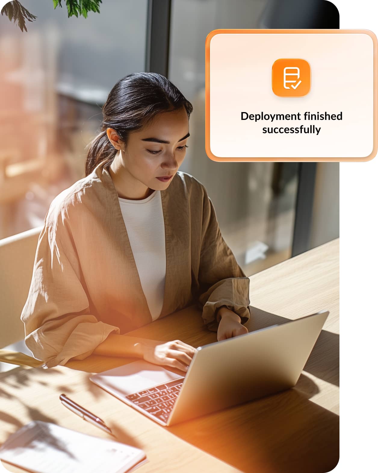 Female employee receives message that deployment finished successfully