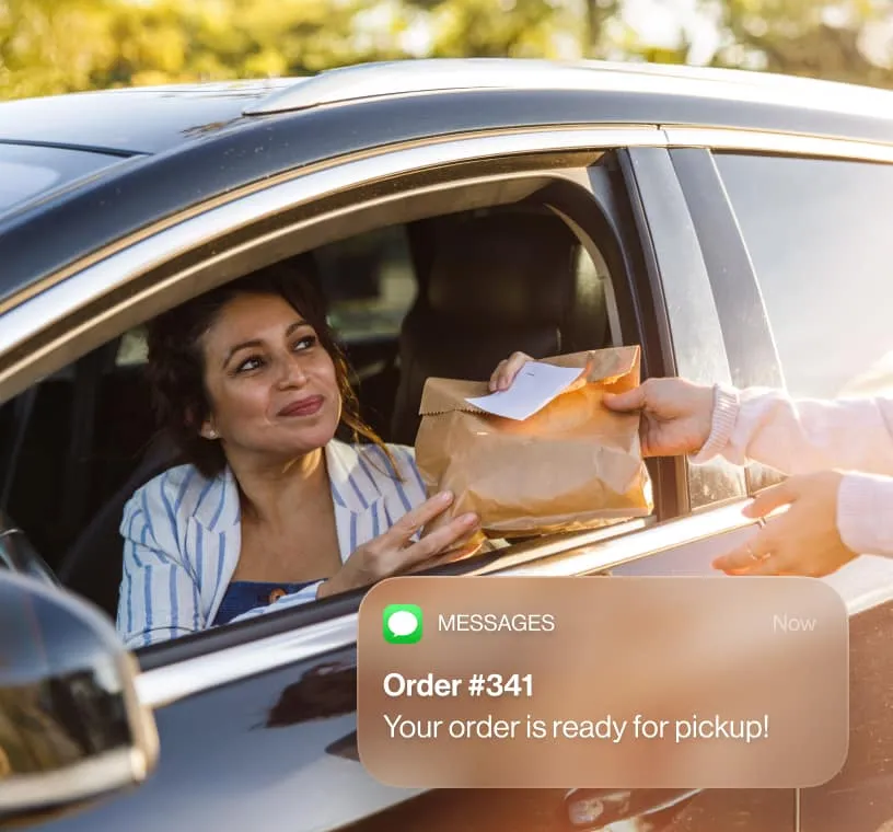 A female customer receiving an SMS message about her order status