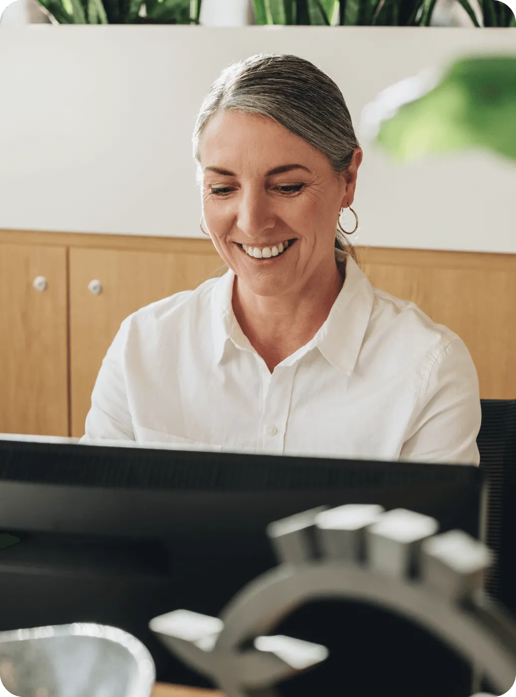 A female admin executive looking at her screen