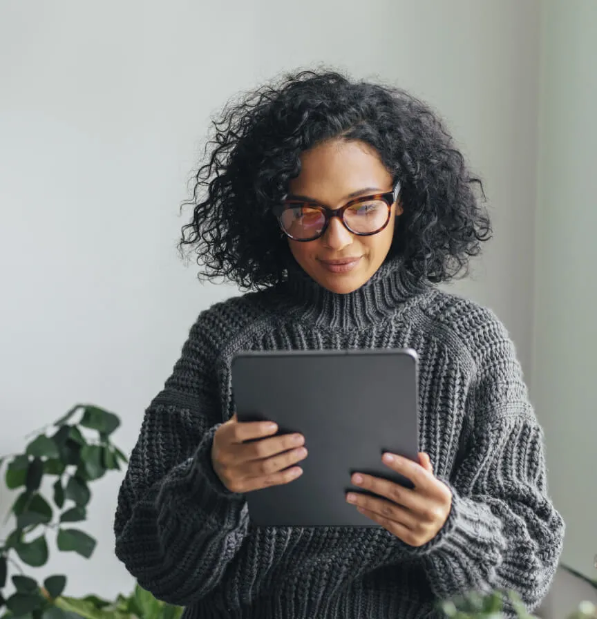 A woman reading RingCentral Transparency Reports on her tablet