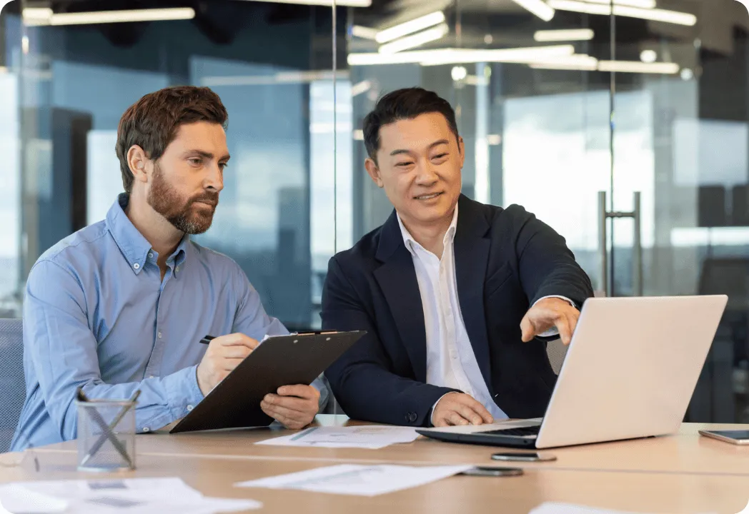 Two male employees in discussion